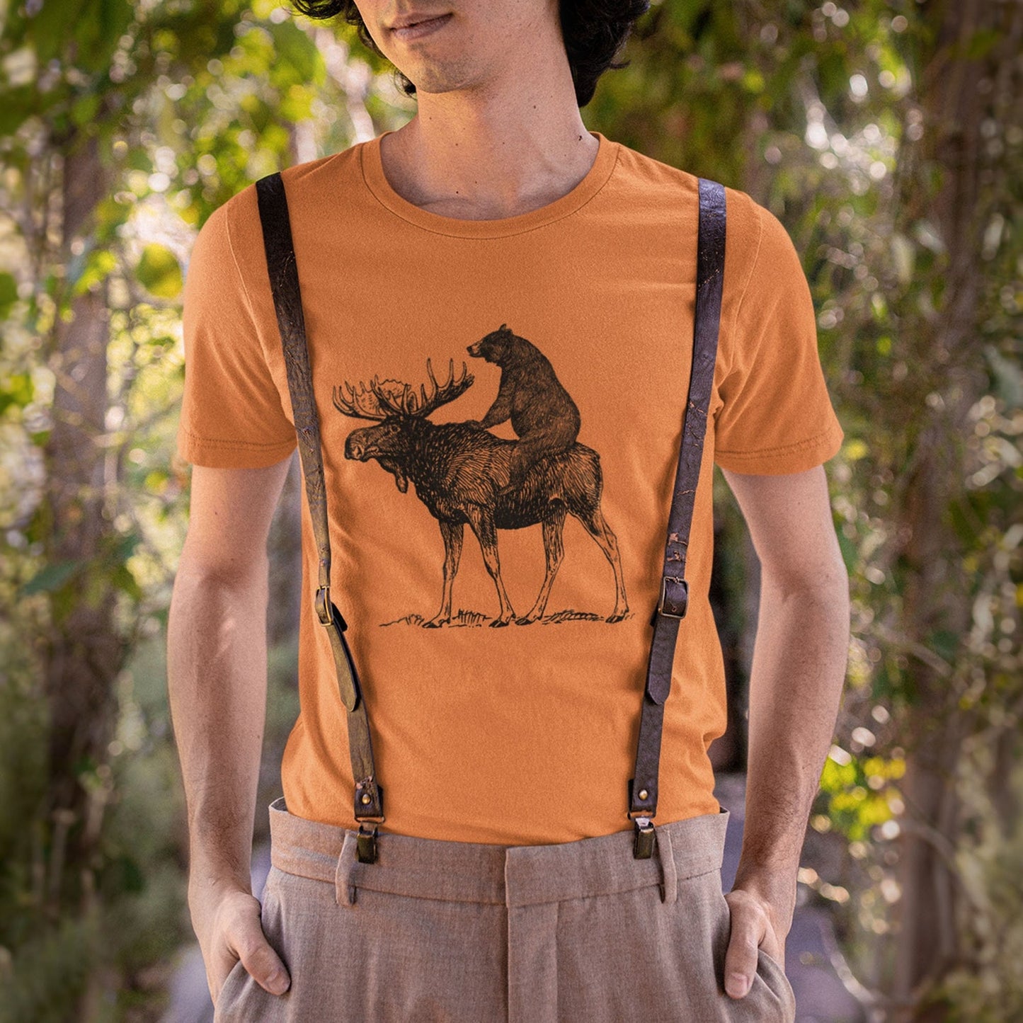Funny bear riding moose graphic on soft cotton fabric